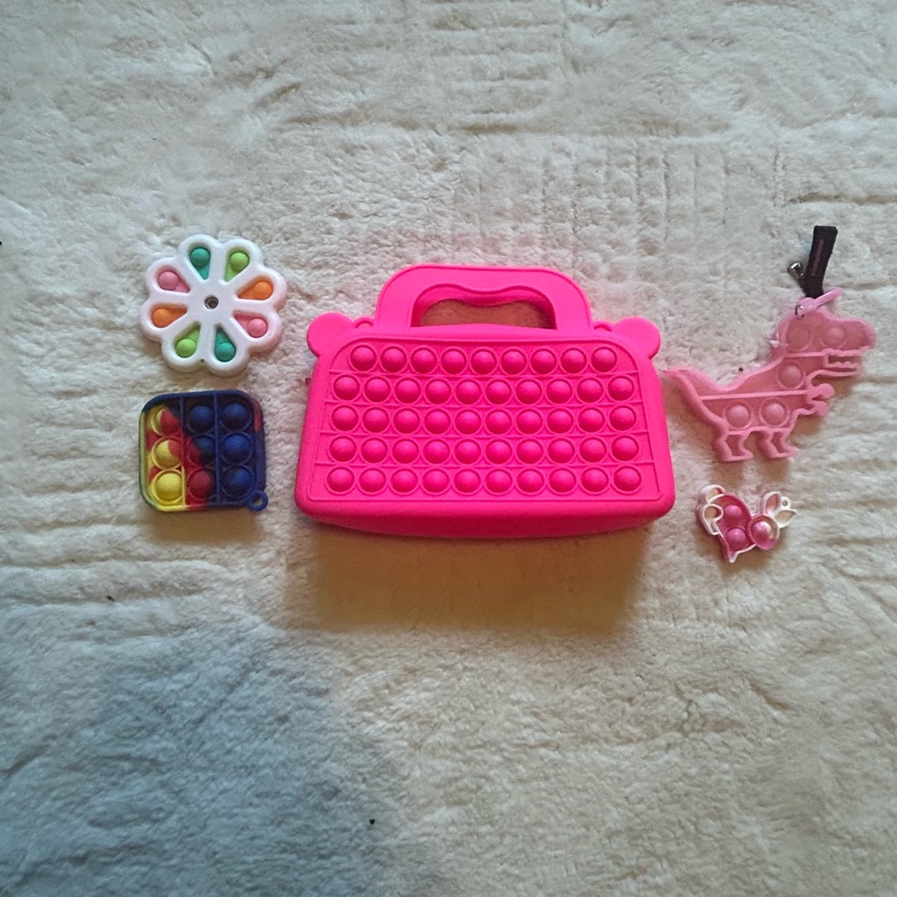 Vibrant Pink Learning Toy pocketbook with zipper with Decorative Elements
